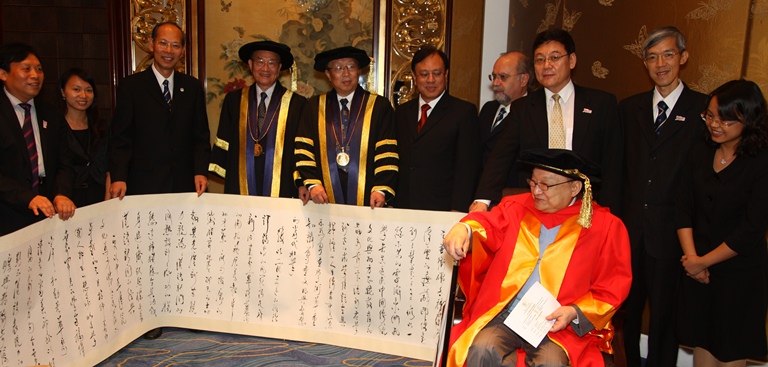 Renowned Chinese martial arts novelist Dr. Louis Cha receives